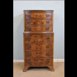 Burr walnut bow fronted chest of drawers.