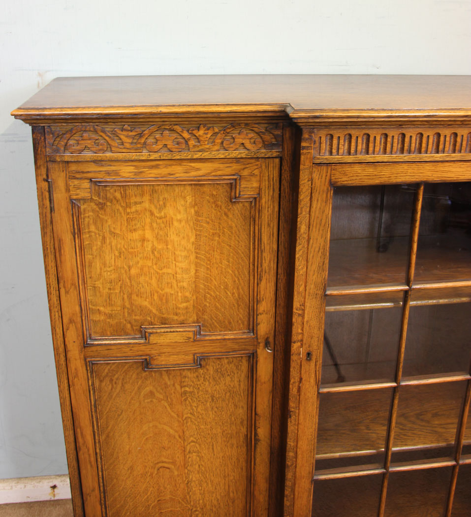11377r11 Antique Oak Cabinet Bookcase, Antique Breakfront Oak Cabinet Bookcase. This quality oak breakfront bookcase cabinet has a solid oak top with moulded edge under having carved detail